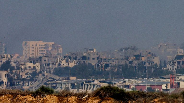 View of buildings destroyed in Israeli strikes as smoke rises in Gaza, amid the ongoing conflict between Israel and the Palestinian Islamist group Hamas, as seen from southern Israel, December 6, 2023. REUTERS/Athit Perawongmetha
