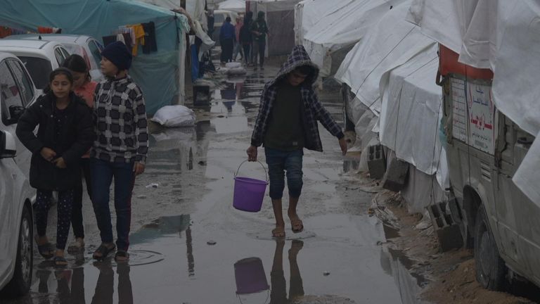 Heavy rainfall overnight flooded Gaza&#39;s streets and tented camps sheltering thousands of displaced people