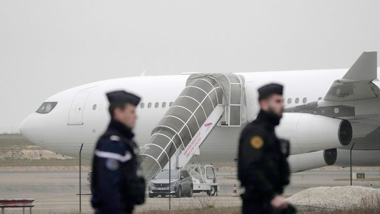 Gendarmes patrol by the plane grounded by police  
Pic:AP