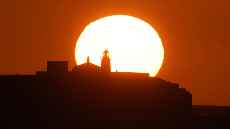 File photo dated 23/05/2023 of the sun rising over the Inner Farne Lighthouse in the Farne islands