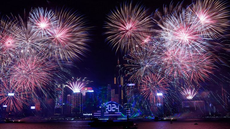 Fireworks explode over Victoria Harbour to celebrate the New Year in Hong Kong