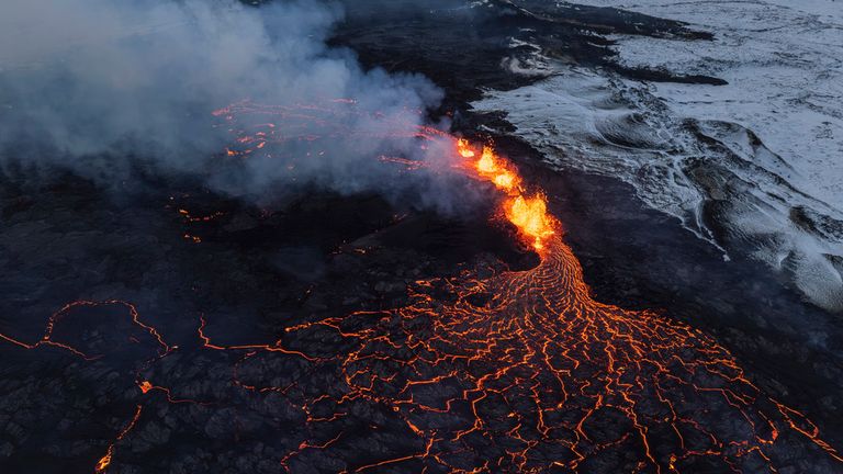 A close up of the Southern active segment of the original fissure of an active volcano in Grindavik on Iceland&#39;s Reykjanes Peninsula, Tuesday, Dec. 19, 2023. (AP Photo/Marco Di Marco)
