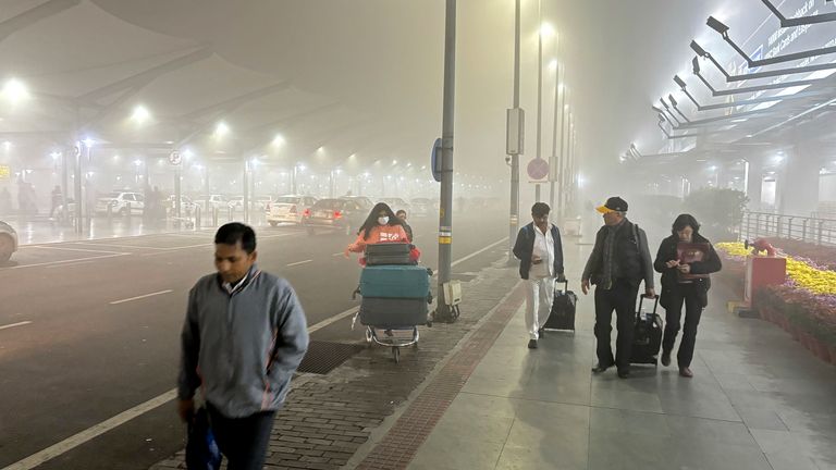 Travelers walk to get transport amidst early morning fog at the Indira Gandhi International Airport in New Delhi, India
Pic:AP