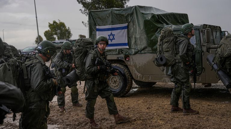 Israeli soldiers prepare to enter the Gaza Strip (Pic: AP)