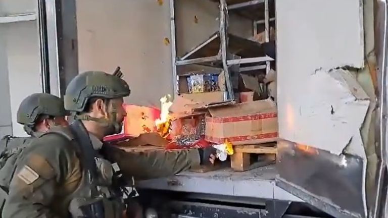 IDF troops burn items in back of truck