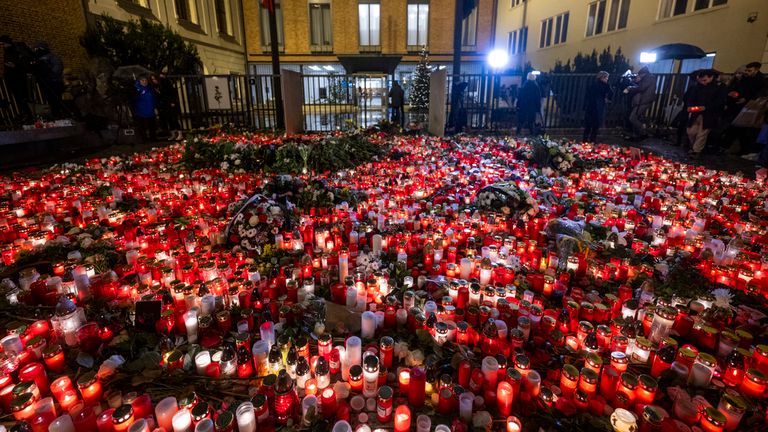 People light candles on Jan Palach Square for the victims of the shooting from the previous day at the Faculty of Arts, Charles University, in Prague, Czech Republic, on December 22, 2023. Twenty-four-year-old student shot dead 14 people and wounded 25 others at the school. Photo/Roman Vondrous (CTK via AP Images)


