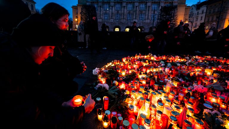 People light candles on Jan Palach Square for the victims of the shooting from the previous day at the Faculty of Arts, Charles University, in Prague, Czech Republic, on December 22, 2023. Twenty-four-year-old student shot dead 14 people and wounded 25 others at the school. Photo/Roman Vondrous (CTK via AP Images)


