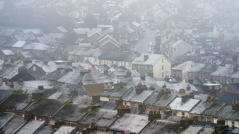 A view of snow covered houses in Dover, Kent, as scattered weather warnings for snow and ice are in place across the UK as temperatures plunged below freezing overnight. The Met Office has issued yellow warnings through Saturday morning for the northern coast and southwest of Scotland, as well as southwest and the eastern coast of England. Picture date: Saturday December 2, 2023.