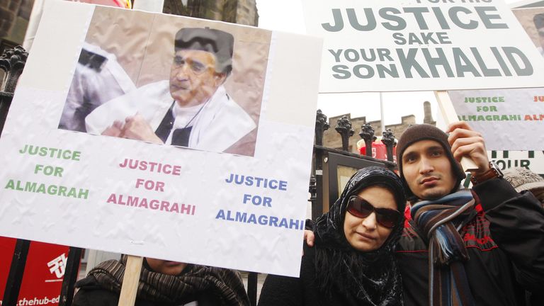 Aisha Al Megrahi, wife of the Lockerbie bomber Adbeldbaset Ali Mohmed Al Megrahi with his son Khalid during a candle-lit vigil to highlight alleged miscarriages of justice outside the Scottish Parliament in Edinburgh.