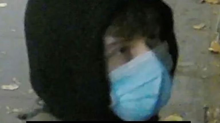 Police want to talk to a man seen on CCTV wearing a hood and a blue face mask