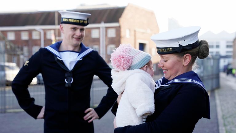 AB Lucy Phillips (right) and her fiance AB Luke Gorst meet family after the Royal Navy aircraft carrier HMS Prince of Wales returns to Portsmouth Naval Base following it&#39;s three-month deployment to the Eastern Seaboard of the United States, where the Prince of Wales has been undergoing trials and operating with aircraft and drones. Picture date: Monday December 11, 2023. PA Photo. See PA story DEFENCE Carrier. Photo credit should read: Andrew Matthews/PA Wire