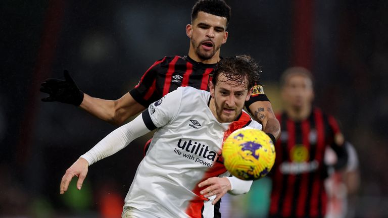 Luton Town&#39;s Tom Lockyer (front) and Bournemouth&#39;s Dominic Solanke battle for the ball 