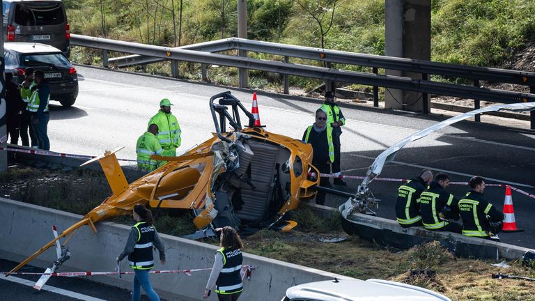 A helicopter after an accident on the M-40 highway, December 1, 2023, in Madrid (Spain). The helicopter model Enstrom 280FX Shark, which crashed at kilometer point 5,600 of the inner ring road of the M-40 in Madrid, was participating in the European Rotors fair that was taking place at Ifema. Two people were inside the helicopter, both with minor injuries and are being attended by the emergency teams. The driver of a vehicle that was traveling on the M-40 at the time of the collision was also injured. 01 DECEMBER 2023 Matias Chiofalo / Europa Press 12/01/2023 (Europa Press via AP)
