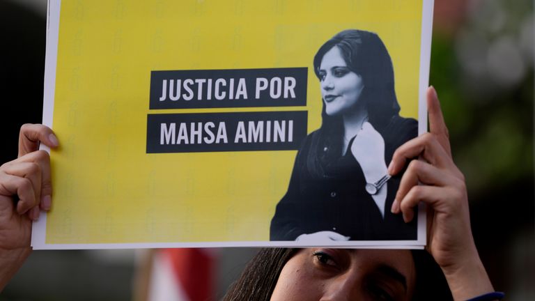 Woman holds a sign that reads in Spanish "Justice for Mahsa Amini",an Iranian woman who died while in police custody in Iran,Sept. 27, 2022. Pic: AP