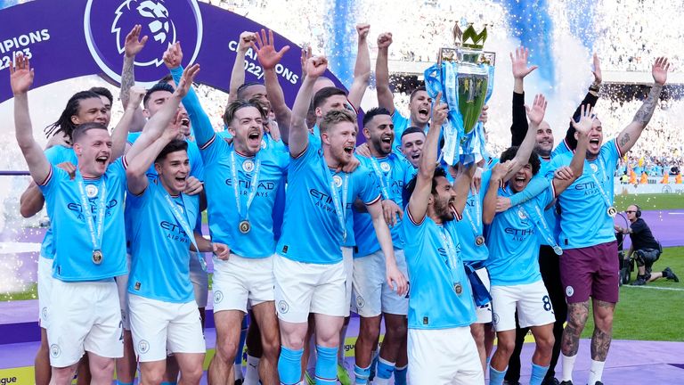 Manchester City players celebrate in May winning the Premier League title for the 2022-2023 season