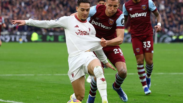 Manchester United, playing in white, continued their poor form this season by losing 2-0 to West Ham