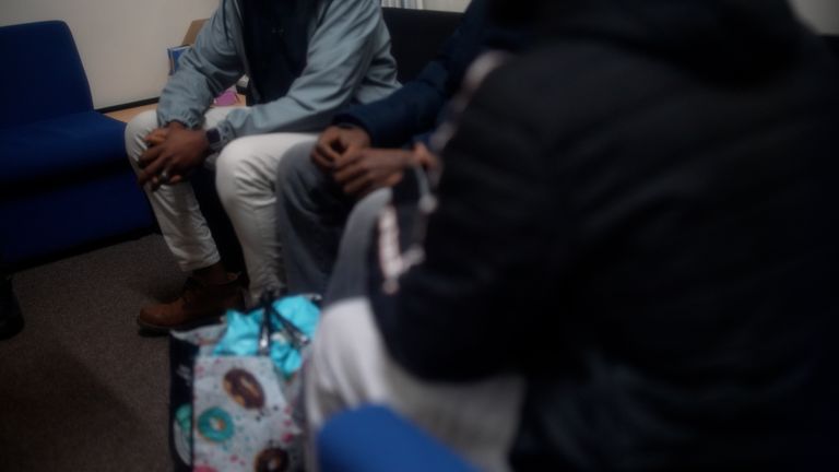 A group of refugees and asylum seekers waiting to get housing advice at the charity Asylum Link Merseyside in Liverpool