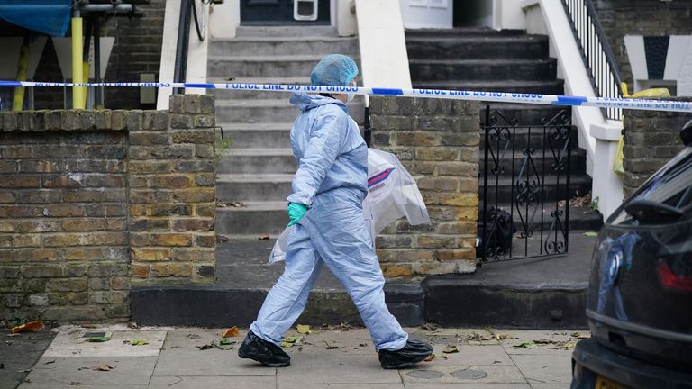 Forensic officers at a property on Montague Road in Dalston, east London, where a four-year-old boy has died after suffering knife injuries. A 41-year-old woman has been arrested on suspicion of murder, the Metropolitan Police said. Picture date: Thursday December 21, 2023.
