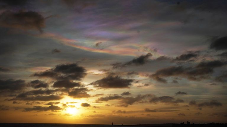 Rare Nacreous clouds, known as rainbow clouds, form in the skies off the coast of Tynemouth in the north east of England