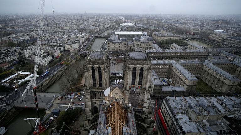 Notre Dame de Paris cathedral is pictured form the spire of the monument, Friday, Dec. 8, 2023 in Paris, France. French President Emmanuel Macron is visiting Notre Dame Cathedral on Friday, marking the one-year countdown to its reopening in 2024 following extensive restoration after the fire four years ago. Macron’s visit, continuing his annual tradition since the blaze on April 15 2019, is aimed to highlight the progress in the works, including the near completion of the cathedral spire. Christ