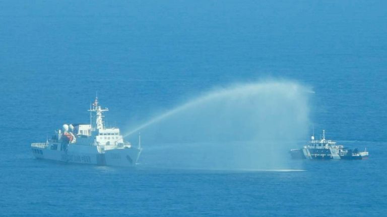 A Chinese Coast Guard ship, left, uses its water cannons on a Philippine Bureau of Fisheries and Aquatic Resources vessel. Pic: Philippine Coast Guard/AP
