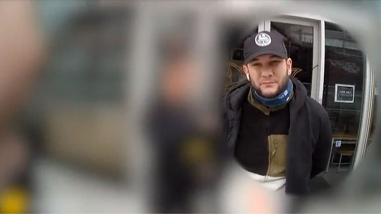 Magomed-Husejn Dovtaev being arrested by counter-terrorism police officers after he was seen filming the headquarters of Persian-language television channel Iran International