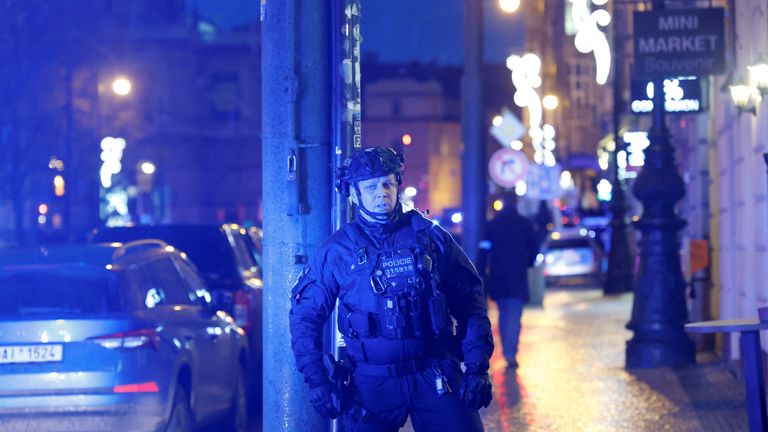 A police officer secures the area following the shooting at one of the buildings of Charles University in Prague, Czech Republic, December 21, 2023. REUTERS/David W Cerny

