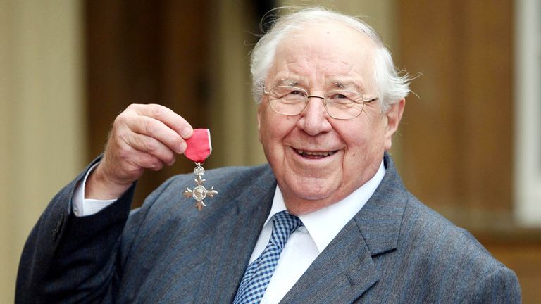 Television presenter Henry Sandon receives his MBE at Buckingham Palace, London.