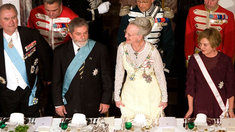 Brazil's President Luiz Inacio Lula da Silva  standing beside Queen Margrethe during a gala dinner at the Fredensborg Palace in 2007