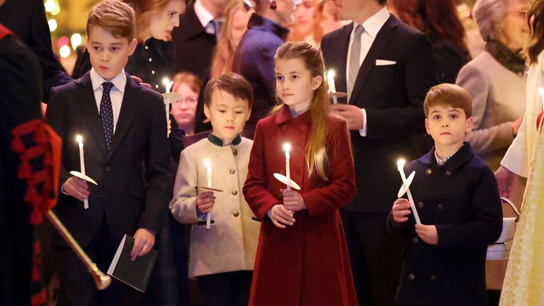 Prince George, Princess Charlotte and Prince Louis hold candles during the Royal Carols - Together At Christmas service at Westminster Abbey in London. Picture date: Friday December 8, 2023.

