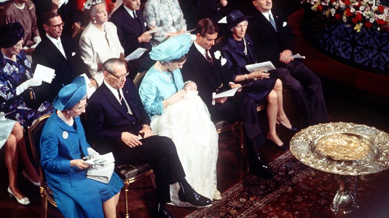 The baptism of Queen Margrethe's son Crown Prince Frederik of Denmark in 1968. Left to right: Queen Ingrid, King Frederik, Princess Margrethe with the crown prince, her husband, Prince Henrik of Denmark, and his parents. Pic: AP
