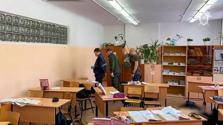 Investigators work at the scene of shooting in a class-room of a school in Bryansk, Russia