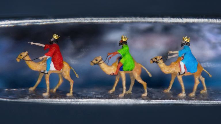 Undated handout photo of the tiny recreation of the three wise men by renowned micro-sculptor Willard Wiga to bring "a little bit of hope and happiness" this festive season. Wigan hand-crafted three wise men wearing 24-carat gold crowns while riding camels made from a tiny segment of nylon and used a microscopic piece of glitter to paint a starry background, all within the eye of a needle. Issue date: Tuesday December 19, 2023.