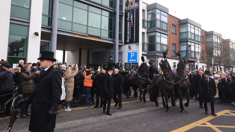 The funeral procession of Shane MacGowan starts from outside Shelbourne Park Stadium as it makes its way through the streets of Dublin ahead of his funeral in Co Tipperary. The songwriter, who found fame as the lead singer of London-Irish punk/folk band The Pogues, died at the age of 65 last week. Picture date: Friday December 8, 2023.