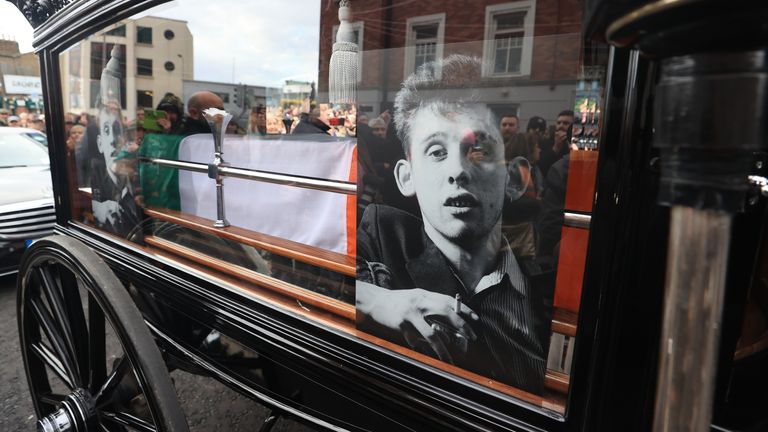The funeral procession of Shane MacGowan makes its way through the streets of Dublin ahead of his funeral in Co Tipperary. The songwriter, who found fame as the lead singer of London-Irish punk/folk band The Pogues, died at the age of 65 last week. Picture date: Friday December 8, 2023.