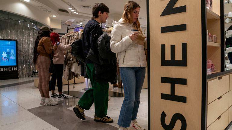 FILE PHOTO: People shop at the Shein Holiday pop-up shop inside of Times Squares Forever 21 in New York City, U.S., November 10, 2023.REUTERS/David &#39;Dee&#39; Delgado/File Photo