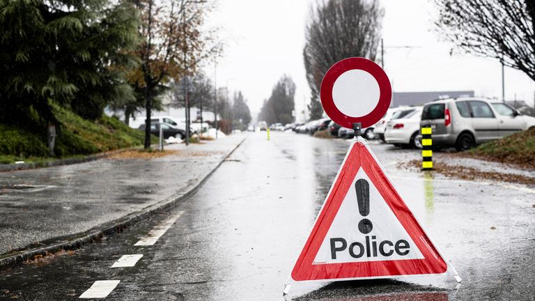 A police warning sign ahead of a closed road after a shooting incident, in Sion, Switzerland
Pic:Keystone /AP