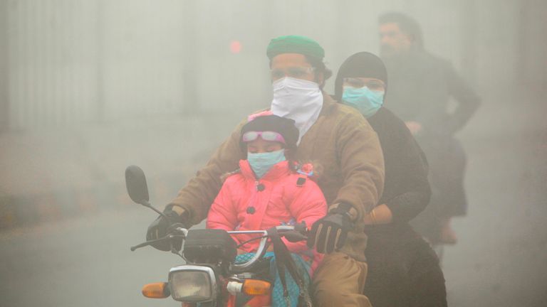 People use face masks to protect themselves from the smog