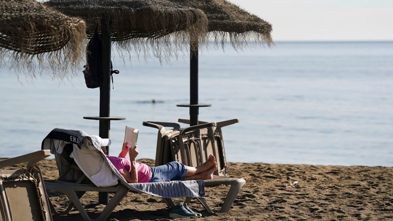 Sunbathing in Spain in December. Pic: AP