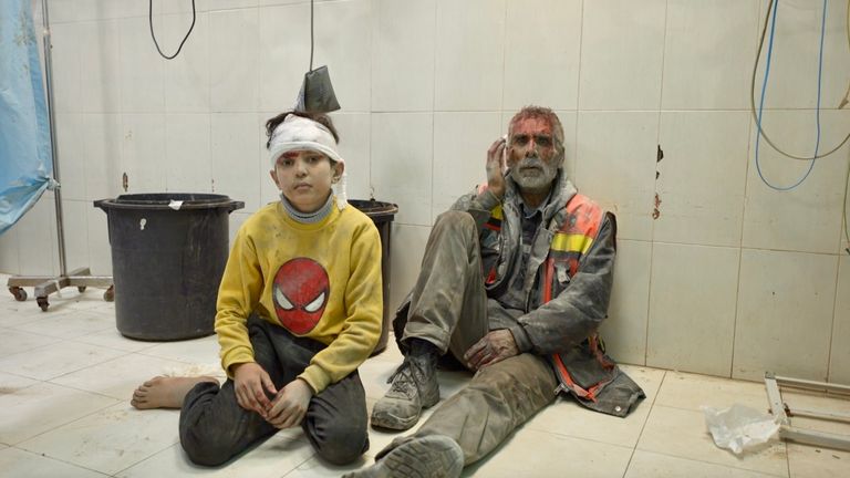 An injured man and child at a hospital in Gaza 