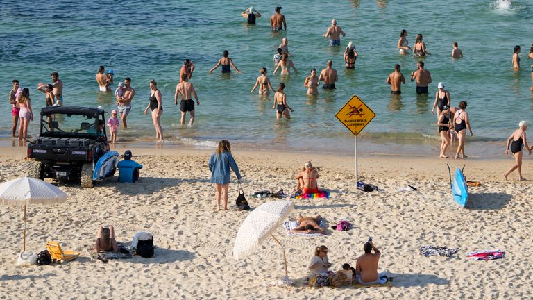 People swim at Sydney&#39;s Bondi beach as temperatures in excess of 40 degrees Celsius (104 degrees Fahrenheit) are expected to hit parts of eastern Australia, Saturday, Dec. 9, 2023. Heatwave warnings are in place across parts of all mainland states in Australia, with extreme to catastrophic fire danger alerts issued on Friday for sections of South Australia, northern Victoria, outback NSW and Greater Sydney. (AP Photo/Mark Baker)