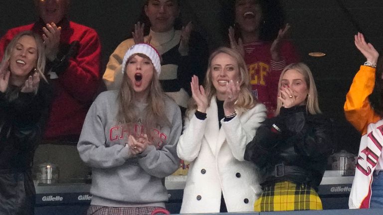 Taylor Swift, center left, celebrates with Brittany Mahomes, center right, after the Kansas City Chiefs scored a touchdown during the first half of an NFL football game against the New England Patriots, Sunday, Dec. 17, 2023, in Foxborough, Mass. (AP Photo/Charles Krupa)