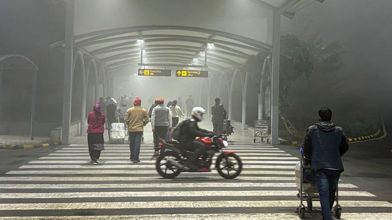 Travelers walk towards the terminal to take flights amidst early morning fog at the Indira Gandhi International Airport, in New Delhi
Pic:AP