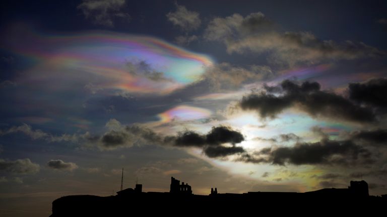Rare Nacreous clouds, known as rainbow clouds, form in the skies over Tynemouth Priory  in the north east of England 