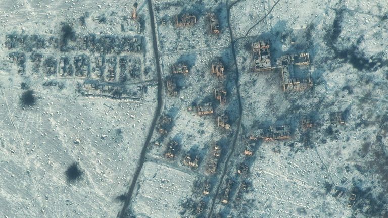 This picture was taken above the snow-covered towns of Soledar and Bakhmut in eastern Ukraine on 10 January, showing bomb craters scattered across the area - including around a destroyed school. Pic: Maxar