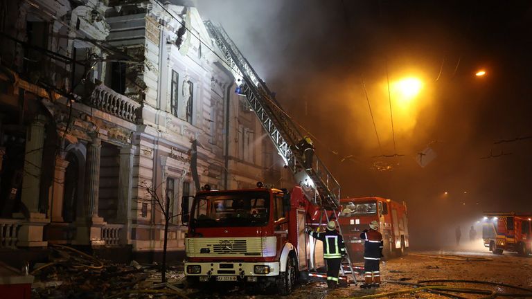 Firefighters tackle a fire after Russia&#39;s missile attack in Kharkiv on New Year&#39;s Eve. Pic: Ukrainian Emergency Service/AP