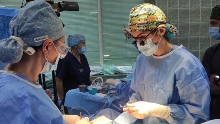 US doctor Laura Bukavina in the operating theatre in Ukraine