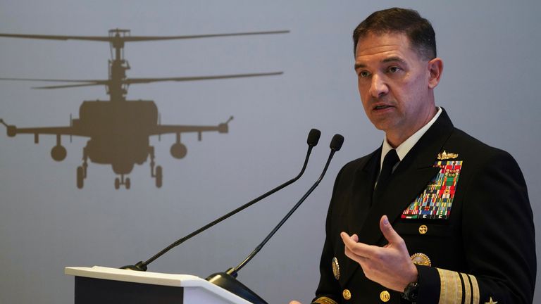 FILE - U.S. Navy Vice Adm. Brad Cooper, who heads the Navy&#39;s Bahrain-based 5th Fleet, speaks at an event at the International Defense Exhibition and Conference in Abu Dhabi, United Arab Emirates, Feb. 21, 2023. The top commander of U.S. naval forces in the Middle East says Yemen...s Houthi rebels are showing no signs of ending their ...reckless... attacks on commercial ships in the Red Sea. But Vice Adm. Brad Cooper said in an Associated Press interview on Saturday that more nations are joining the international maritime mission to protect vessels in the vital waterway and trade traffic is beginning to pick up. (AP Photo/Jon Gambrell, File)