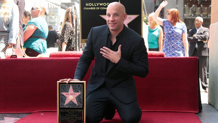Actor Vin Diesel poses with his newly unveiled star on the Hollywood Walk of Fame in Hollywood, California, August 26, 2013. REUTERS/Jonathan Alcorn (UNITED STATES - Tags: ENTERTAINMENT)