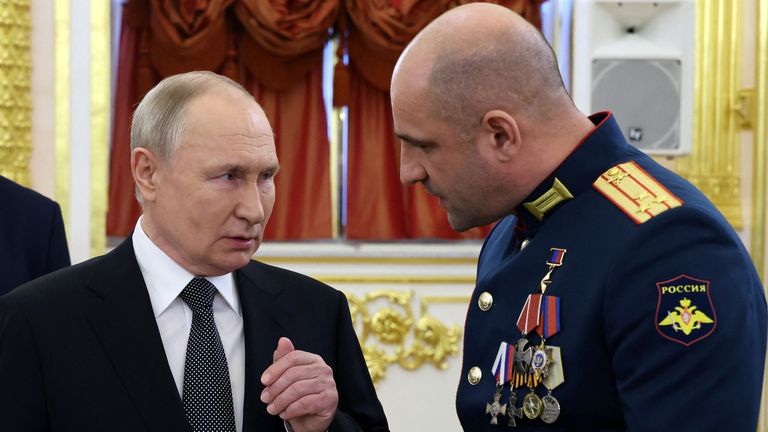 Russian President Vladimir Putin speaks with Sparta battalion commander Artyom Zhoga during a ceremony of awarding Gold Star medals to servicemen, bearing the title of Hero of Russia and involved in the country's military campaign in Ukraine, in on the eve of Heroes of the Fatherland Day in Moscow, Russia, December 8, 2023. Sputnik/Mikhail Klimentyev/Kremlin via REUTERS ATTENTION EDITORS - THIS IMAGE WAS PROVIDED BY A THIRD PARTY.